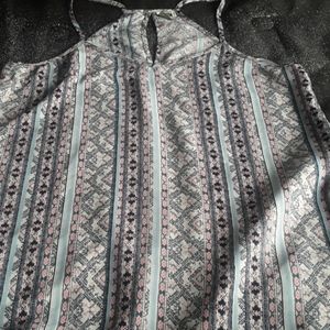 Adorable tank cut out back. New without tags.
